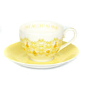 Fine bone china cup and saucer, white with gold scene and “VALE AS OLD AS TIME” text
