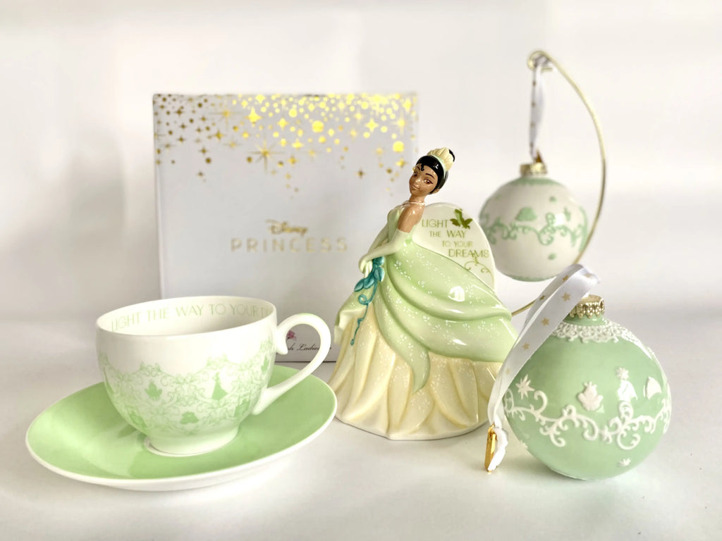 Fine bone china tea cup and saucer set with green floral print and curved handle