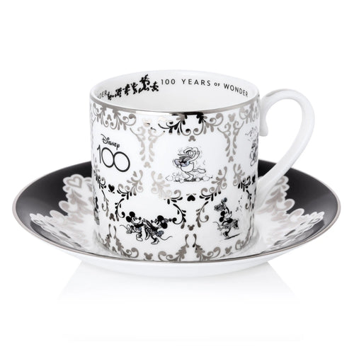 White fine bone china cup with black Mickey/Minnie floral print and 100 Years Wonder