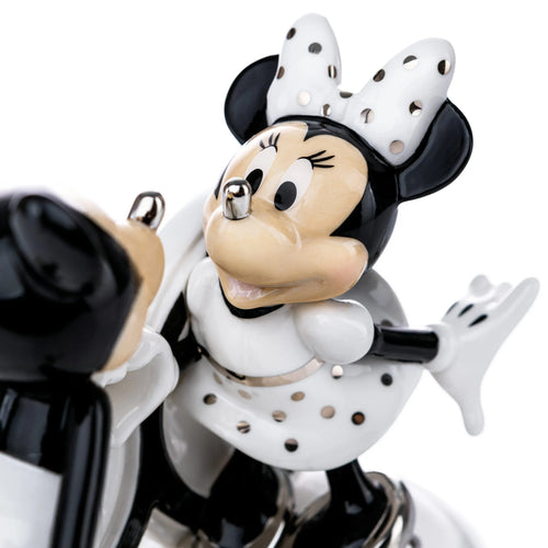 Fine bone china Mickey figurine close-up, black coat, white polka-dot apron