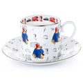 Fine bone china cup and saucer set, white with colorful Paddington-style bear and London icons