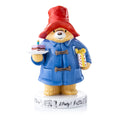 Fine bone china party figurine: blue coat, red hat, holding birthday cake