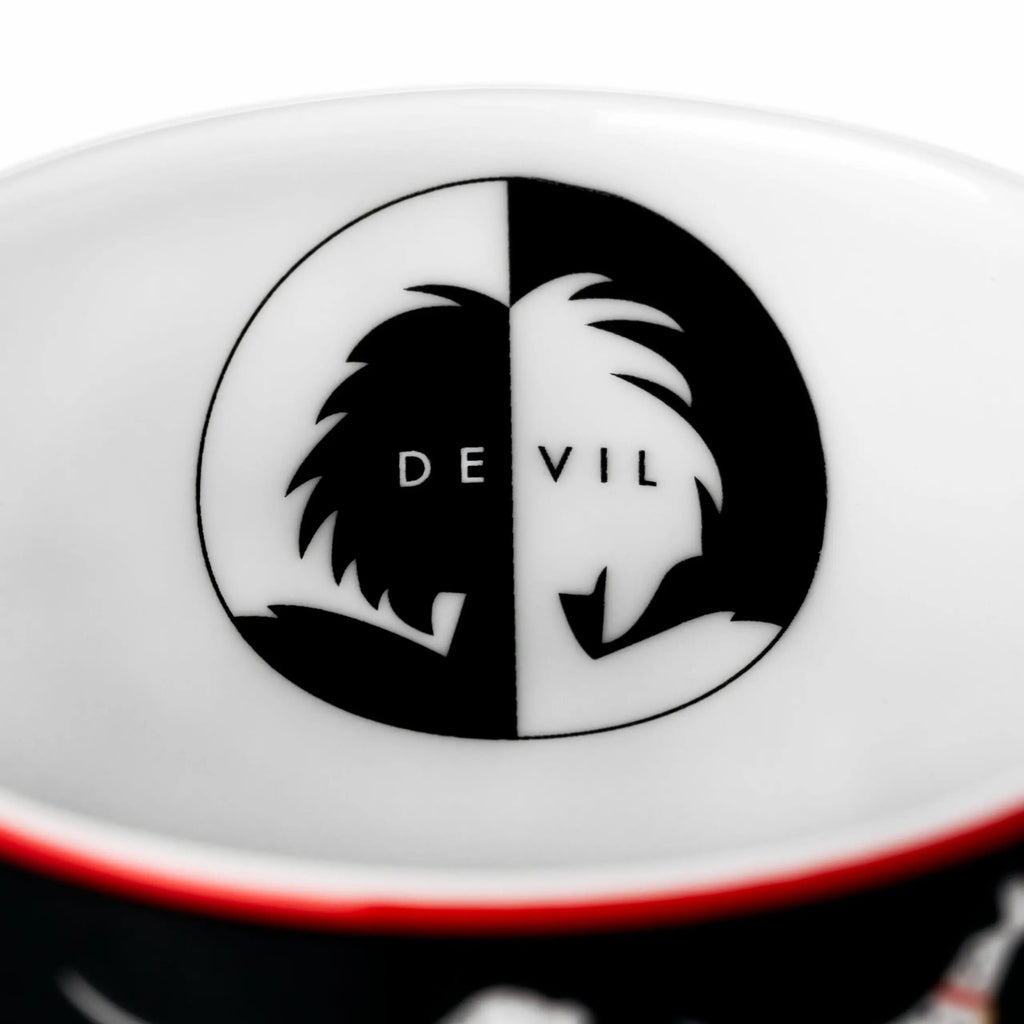 Fine bone china saucer underside with black-and-white oval 'DE VIL' design
