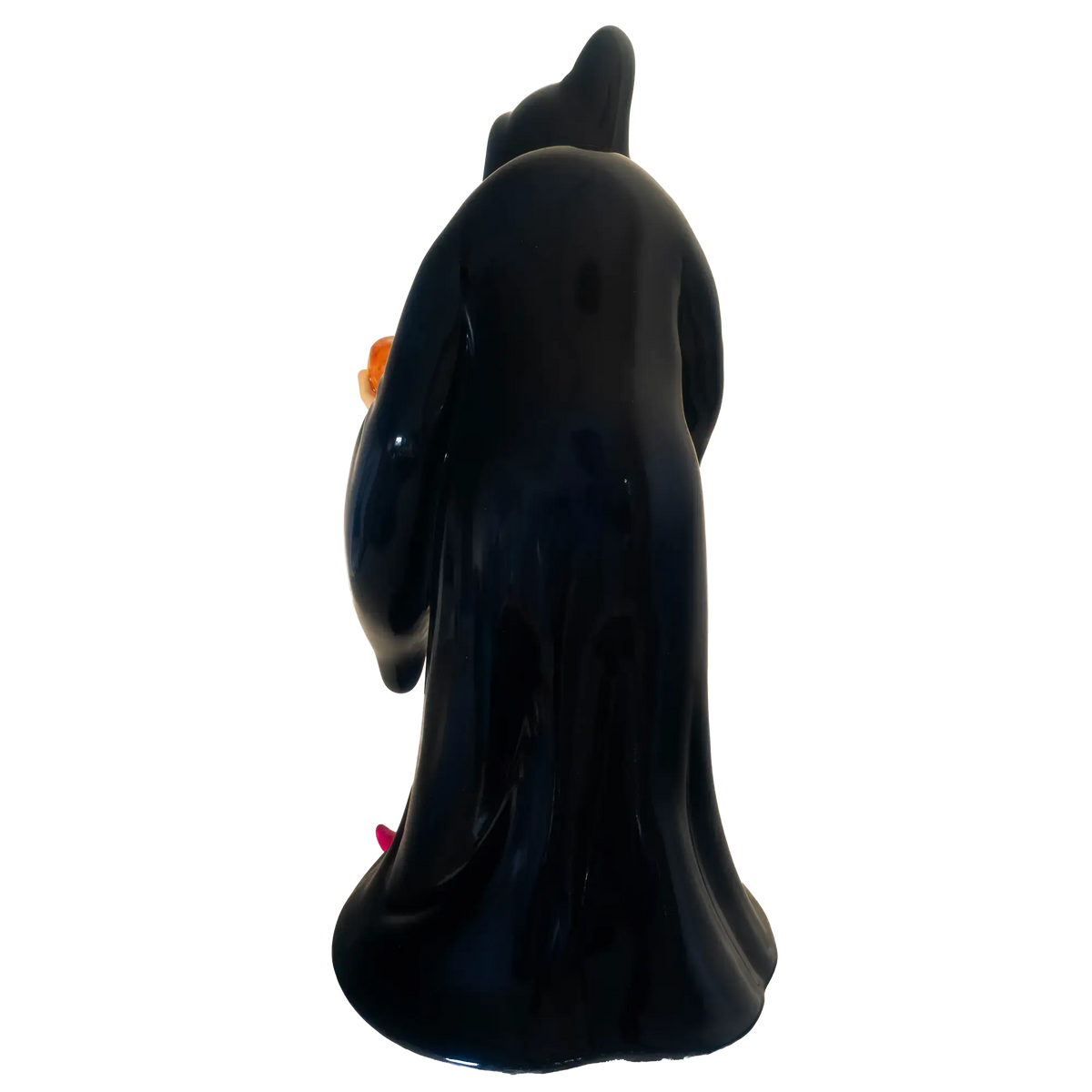 Back view dark blue witch figurine with pointed hat and pink shoes