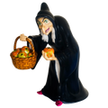 Dark blue witch figurine holding a basket of glowing apples, fine bone china