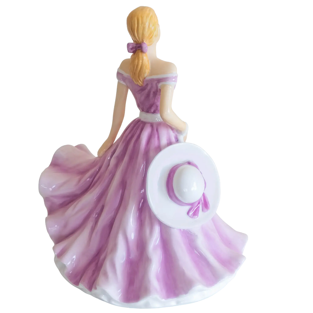 Back view rose-themed purple dress porcelain figurine with white hat