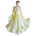 Fine bone china daffodil figurine: seated woman in yellow and white off-shoulder dress