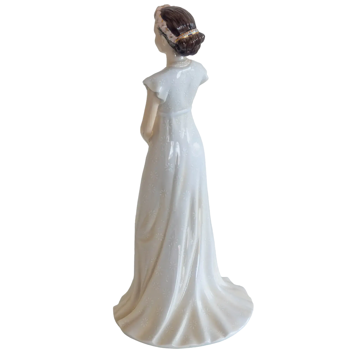 White fine bone china bride figurine back view with flowing skirt and ruffle hem