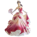 Fine bone china lady figurine in pink and cream ball gown, holding a fan