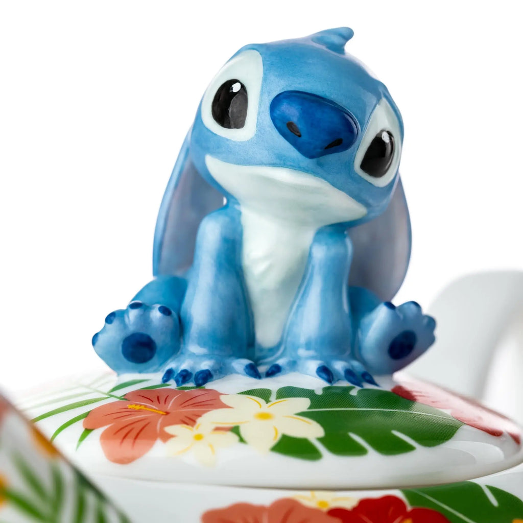 Blue Stitch figurine lid over patterned teacup saucer, fine bone china