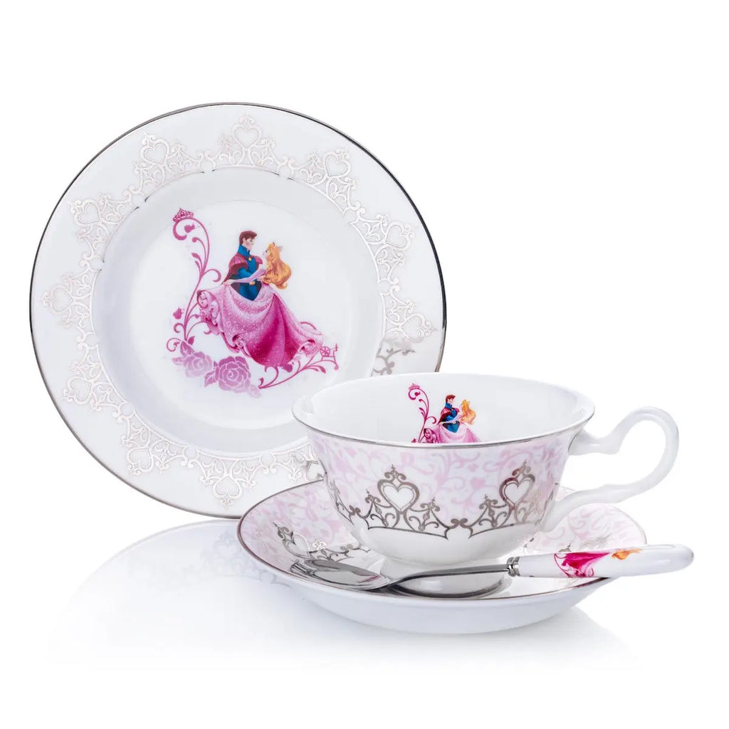 Fine bone china wedding spoon resting with pink character art on patterned cup and saucer