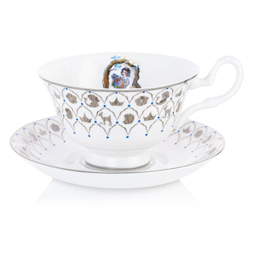 Fine bone china teacup and saucer set with blue pattern, crest, and character art
