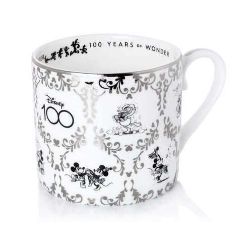 White fine bone china cup with black Mickey/Minnie scene print and 100 Years of Wonder
