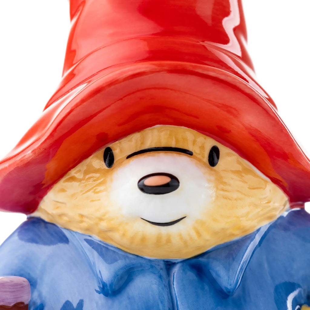 Fine bone china party figurine close-up of face, red hat and blue coat