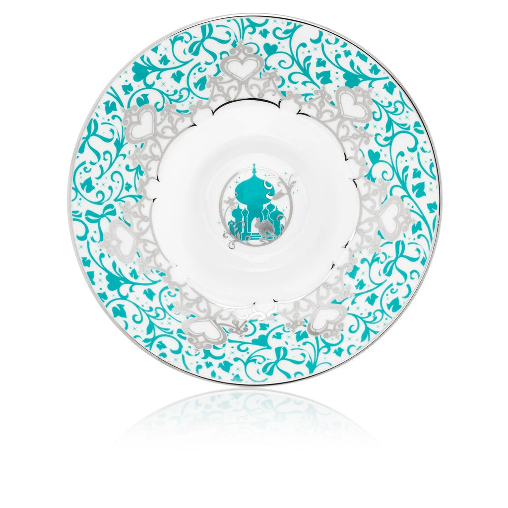 Fine bone china saucer underside with teal floral scroll pattern and central medallion